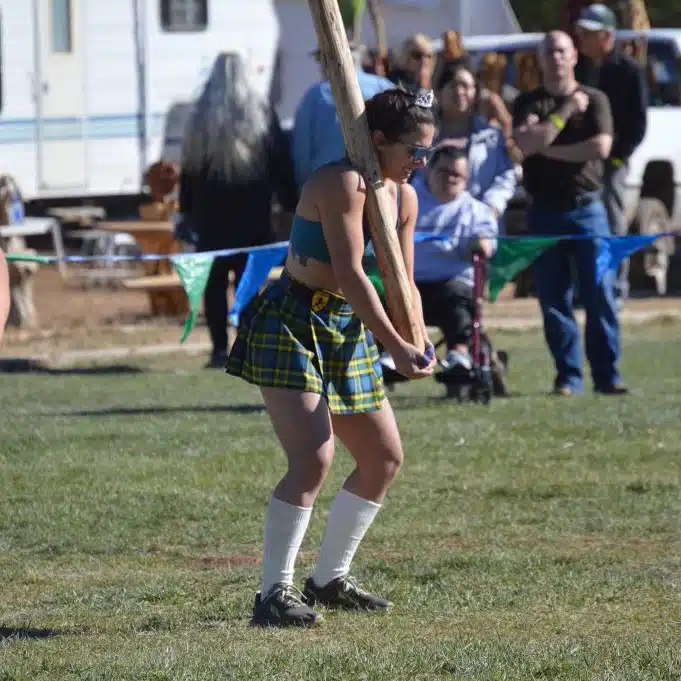 Joanna Pultro performing a caber toss