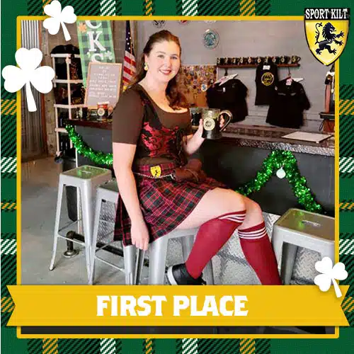 Woman in a kilt sat on a stool