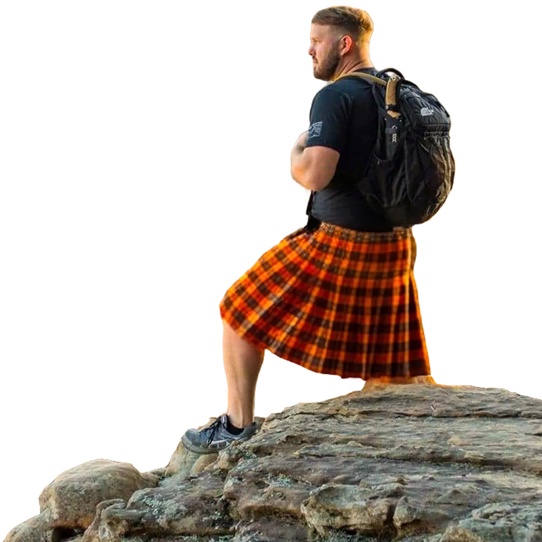 Person stood on a rock wearing a Sport Kilt looking across a valley.